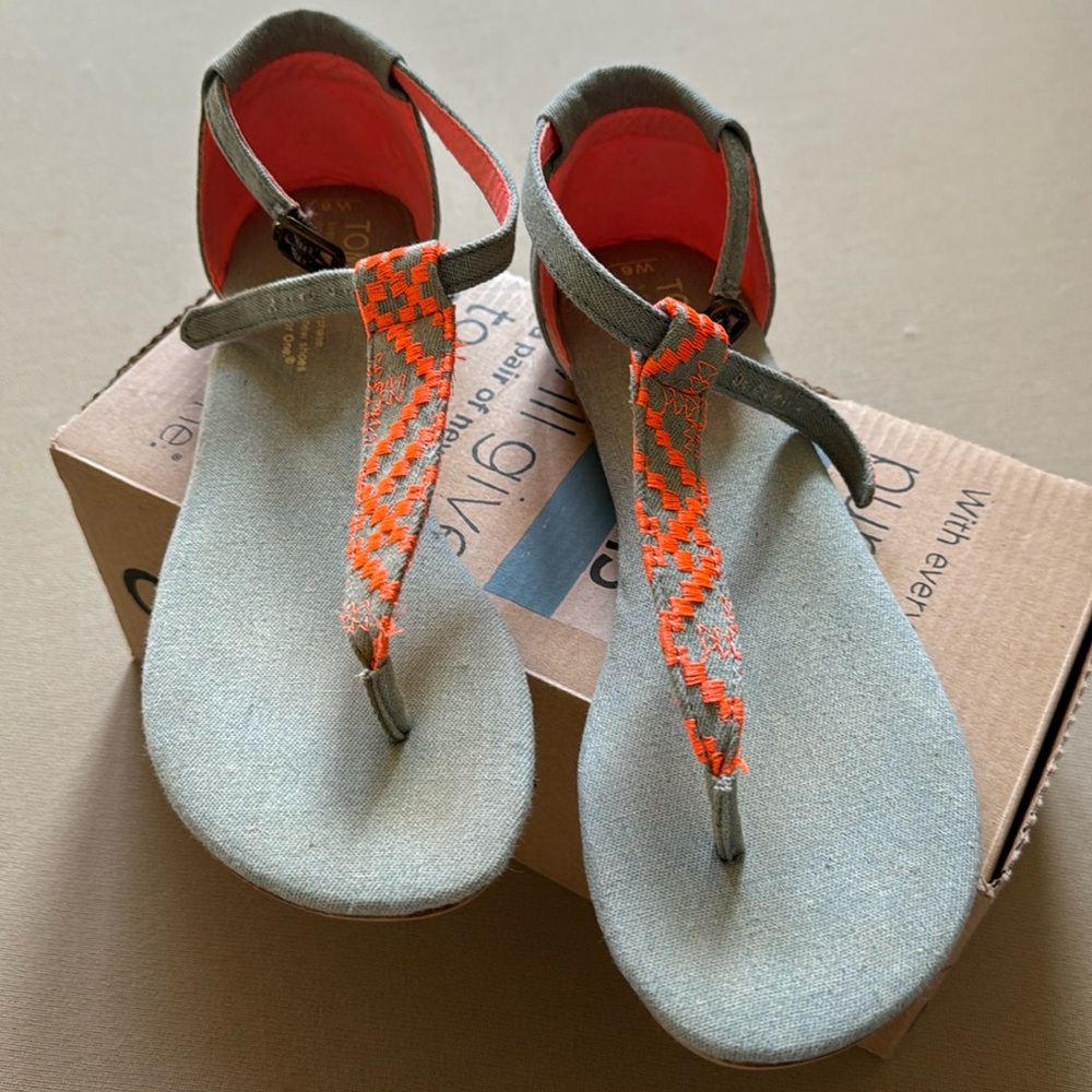 Tom’s grey and  neon orange sandals